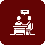 Two people talking at a table icon.